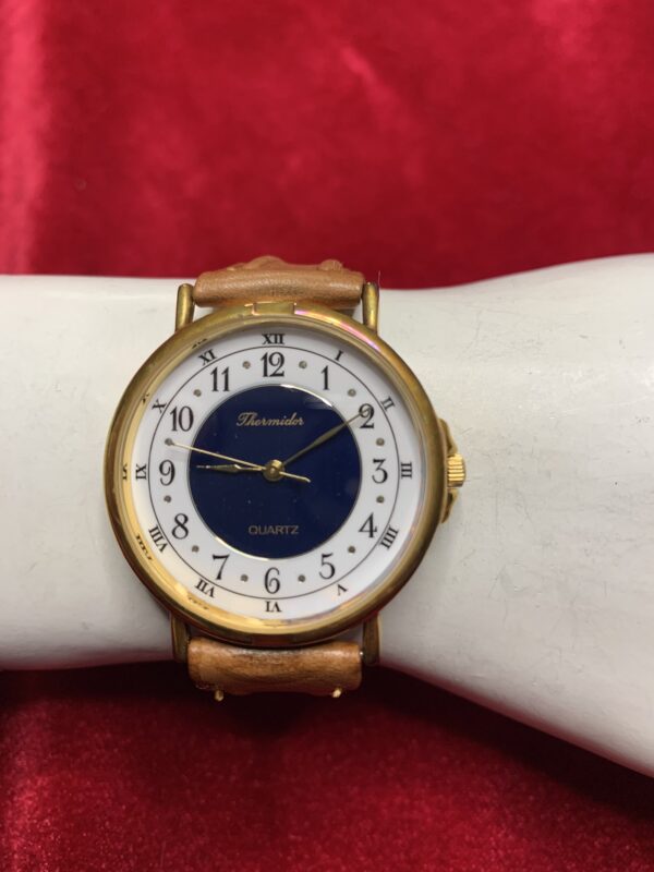 RELOJ; «THERMIDOR» UNISEX CAJA EN DORADO Y PULSERA DE CUERO